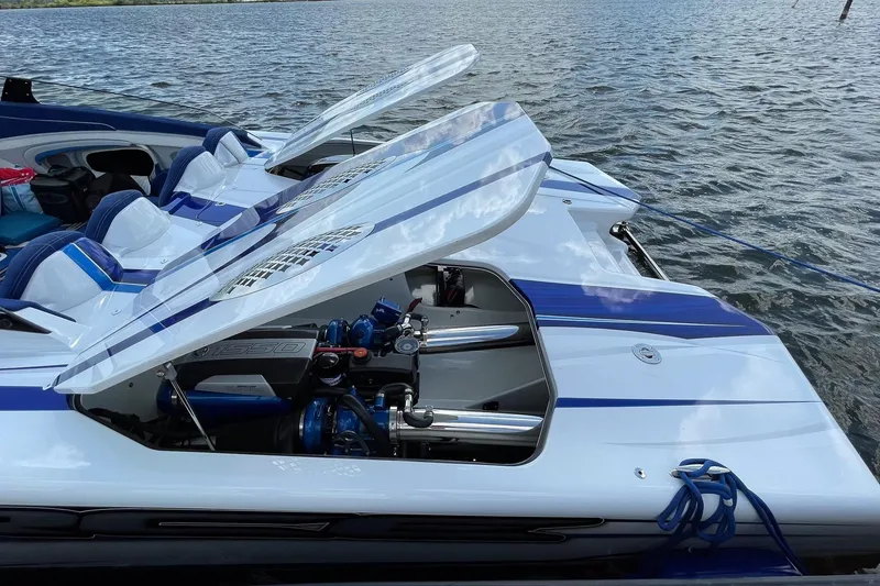 Slide: The Image of High-performance Skater 438 boat with open engine compartment on a lake, 2020 model. - 15