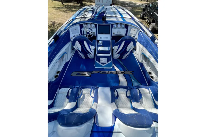 Slide: The Image of Blue and white Skater 438 boat interior, featuring sleek seating and modern dashboard, 2020 model. - 7