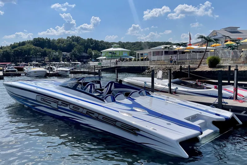 The Image of 2020 Skater 438 speedboat docked at a marina under a sunny sky. - 2