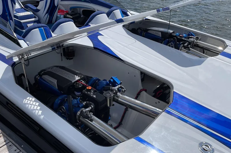 Slide: The Image of High-performance Skater 438 boat engine compartment, showcasing dual engines and sleek interior design. - 14