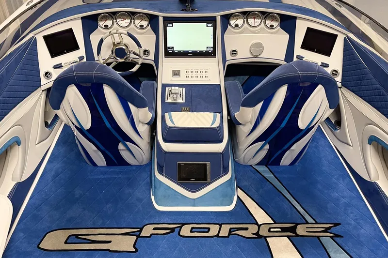 Slide: The Image of Luxurious Skater 438 boat interior, featuring blue and white seating, advanced controls, and "G Force" branding. - 5