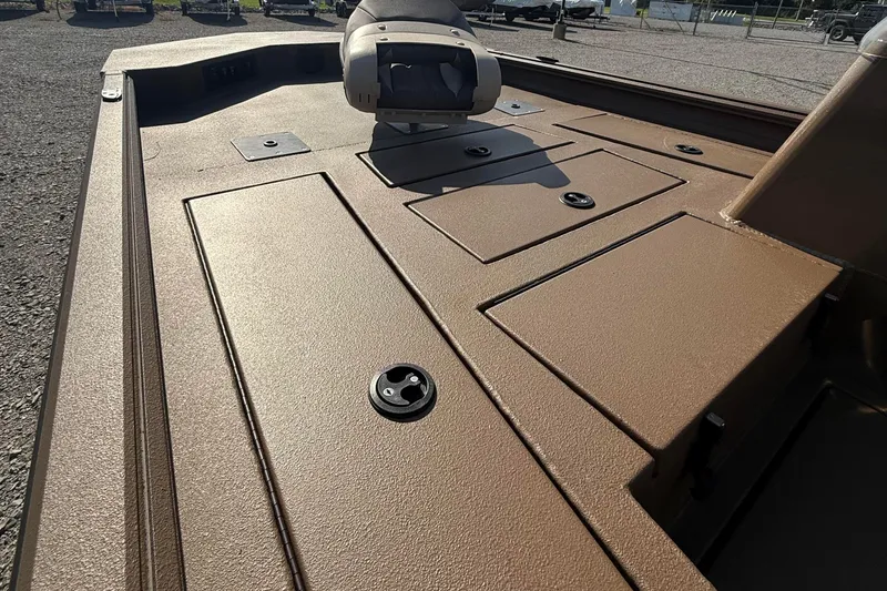Slide: The Image of Brown deck of 2027 Thor LH1900SC boat with storage compartments and seating. - 6