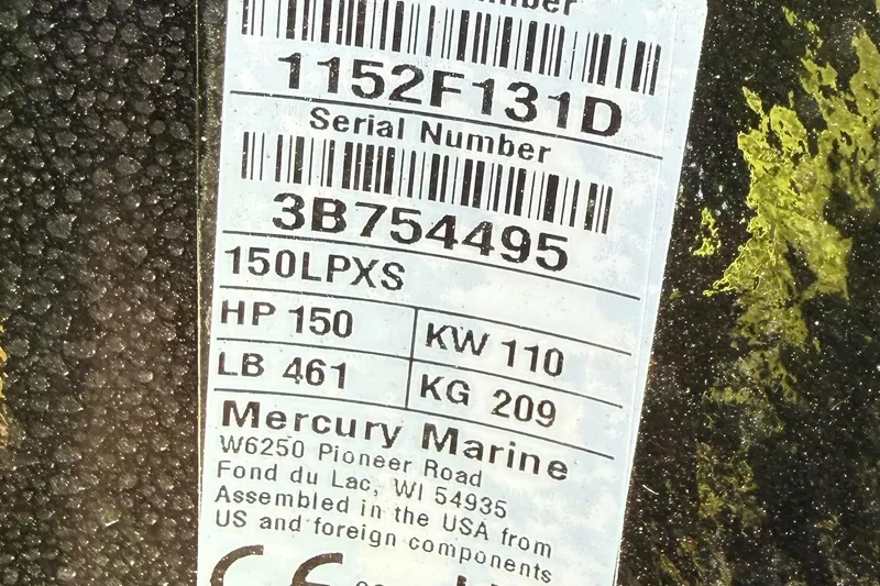 Slide: The Image of Label on Mercury Marine engine, showing serial number, horsepower, and assembly details. - 11