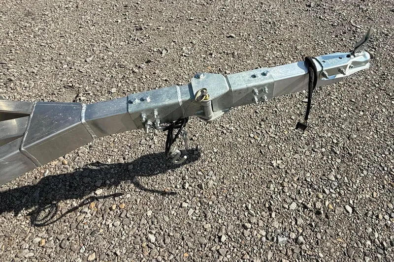 Slide: The Image of Trailer hitch of a 2027 Thor LH1900SC on gravel surface. - 8