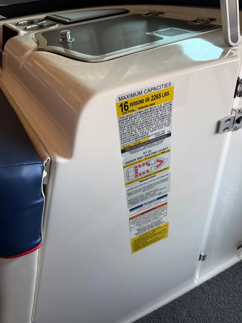 Slide: The Image of The image shows the capacity label of a 2018 MasterCraft XT23, indicating 16 persons or 2265 lbs. - 10