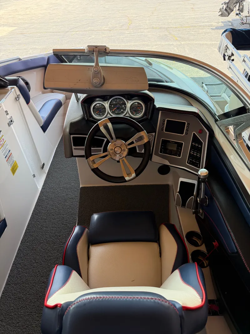 Slide: The Image of The image shows the cockpit of a 2018 MasterCraft XT23 with a modern steering wheel and instruments. - 7