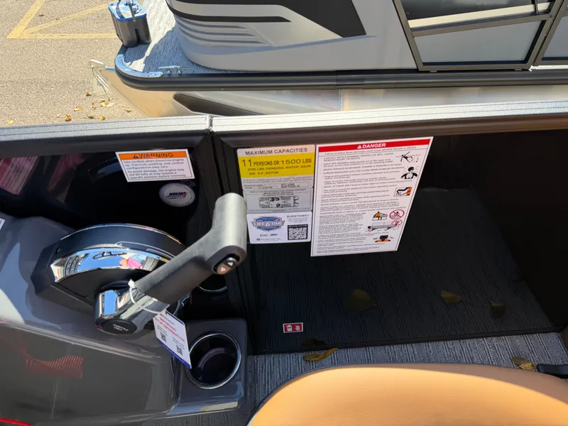 Slide: The Image of Close-up of the helm area of a 2027 Sylvan X1 LZ DH boat. - 19