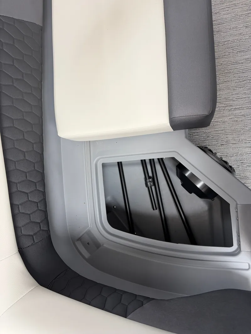 Slide: The Image of Close-up of the seating area in a Sylvan R-22 CLZ DH boat, featuring gray and white upholstery. - 7