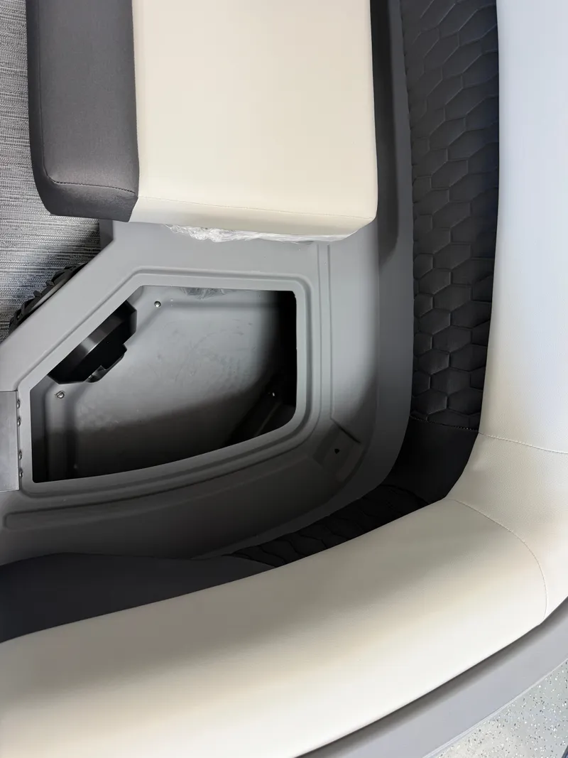 Slide: The Image of Close-up of a boat interior with cushioned seating and storage compartment. - 9