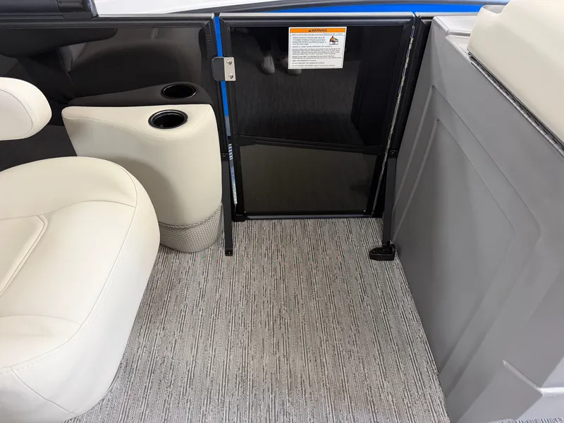 Slide: The Image of Interior of a 2027 Sylvan R-22 CLZ DH with white seating and carpeted flooring. - 12