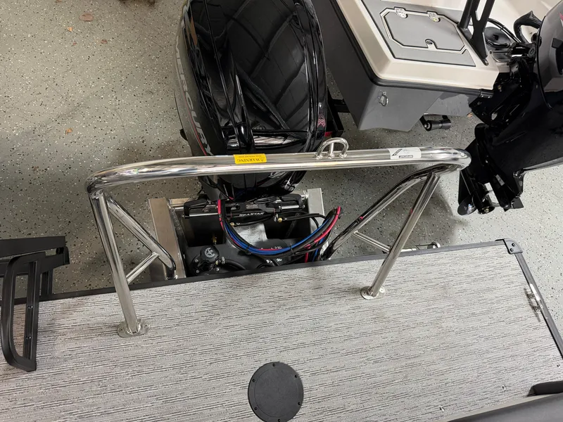 Slide: The Image of Sylvan R-22 CLZ DH 2027 with stainless steel railing and motor on gray deck. - 28