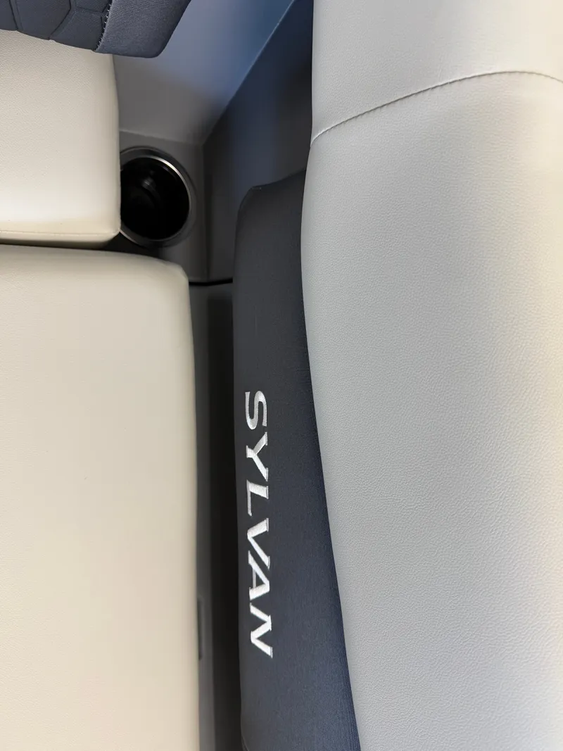 Slide: The Image of Close-up of a Sylvan boat seat with gray and white upholstery. - 23