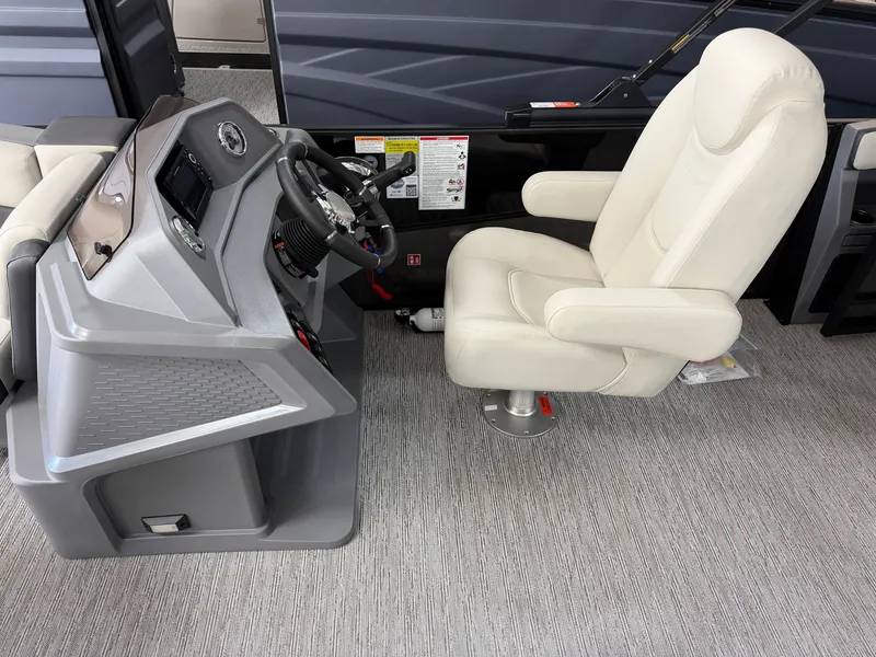 Slide: The Image of The image shows the helm of a 2027 Sylvan R-22 CLZ DH with a comfortable captain's chair. - 13