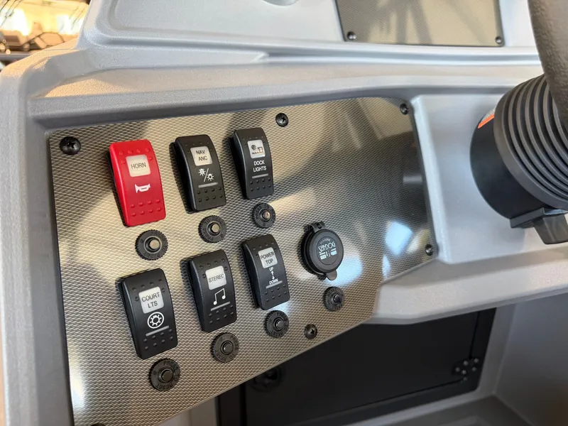 Slide: The Image of Close-up of a Sylvan R-20 LZ DH console with various switches and buttons. - 16