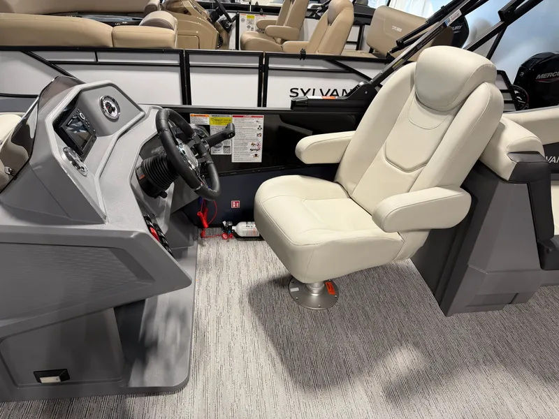 Slide: The Image of The image shows the helm of a 2027 Sylvan R-22 LZ DH with a comfortable captain's chair. - 10