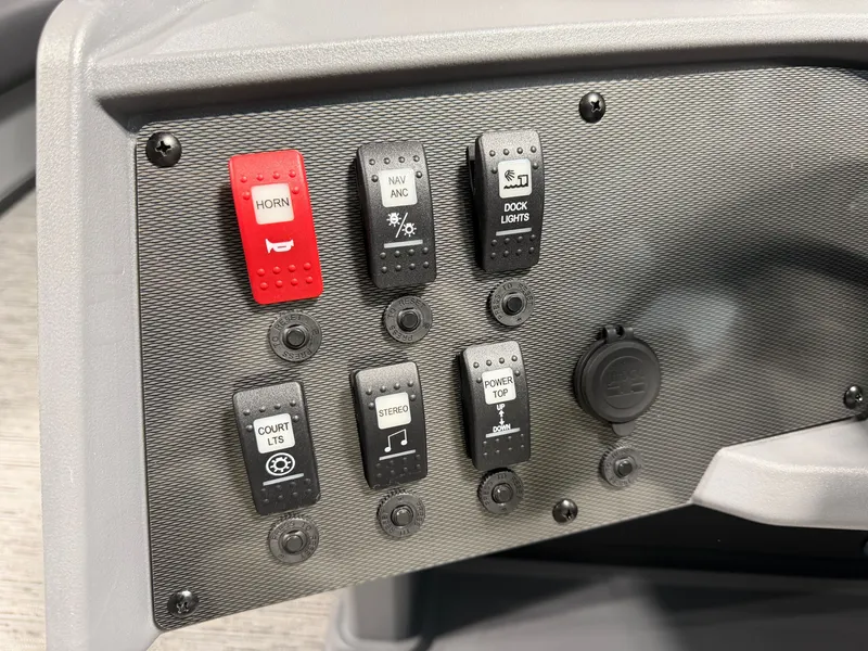 Slide: The Image of Control panel with various switches, including horn, navigation lights, and stereo. - 14