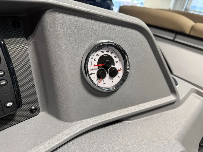 Slide: The Image of Close-up of a speedometer on a gray dashboard of a Sylvan boat. - 15