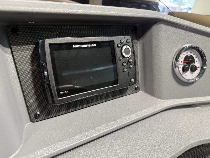 Slide: The Image of The image shows a modern boat cockpit with a Humminbird display and an analog speedometer. - 16