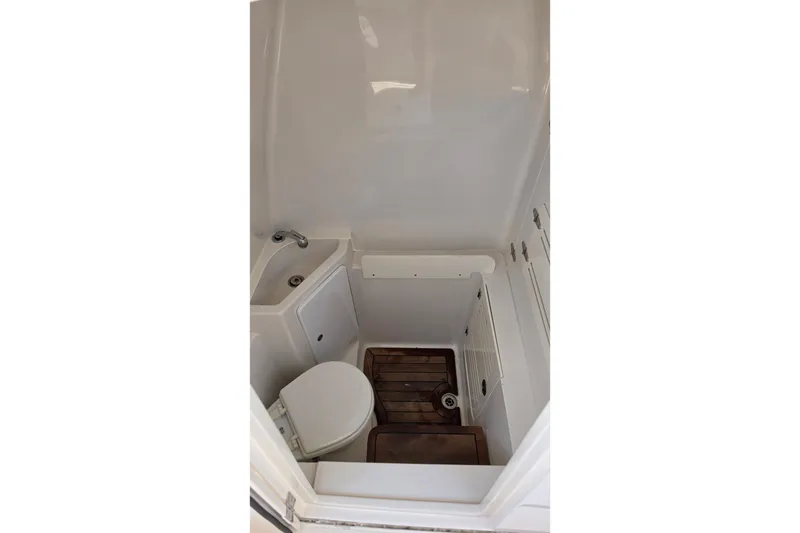 Slide: The Image of Compact bathroom in 2020 Jupiter 34 HFS boat with toilet and sink. - 23