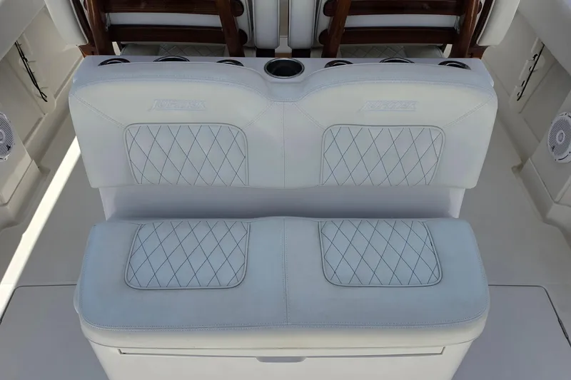 Slide: The Image of Luxury seating on a 2020 Jupiter 34 HFS boat with diamond-stitched upholstery. - 11