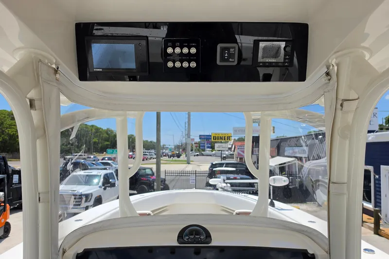Slide: The Image of 2020 Jupiter 34 HFS boat dashboard with electronic controls and display screens. - 13