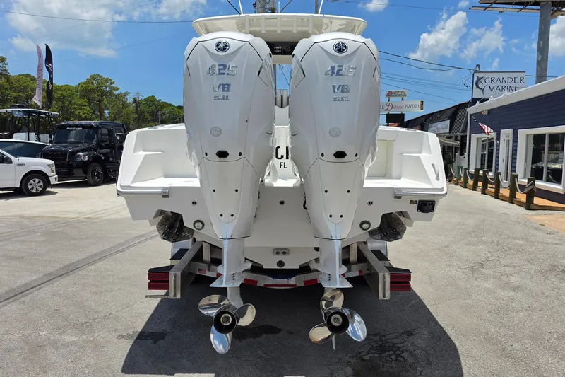 Slide: The Image of 2020 Jupiter 34 HFS boat with twin Yamaha 425 V8 engines at a marina. - 4