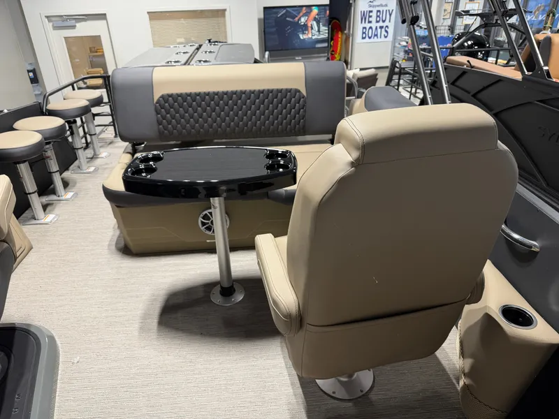 Slide: The Image of Interior of a modern boat with beige seating and a black table. - 18