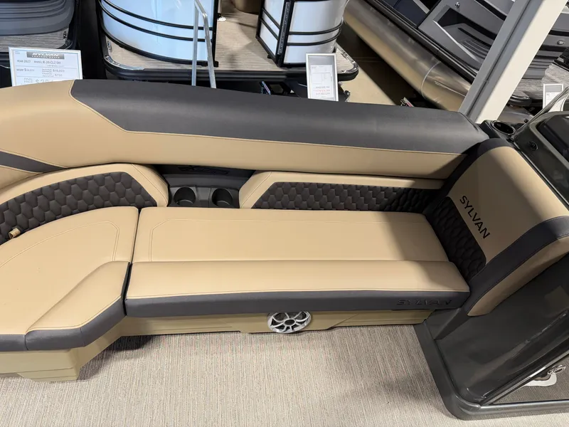Slide: The Image of The image shows a luxurious seating area in a Sylvan X5 DLZ DH BAR boat. - 6