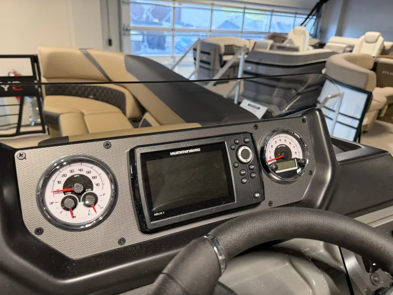 Slide: The Image of The image shows the dashboard of a Sylvan X5 DLZ DH BAR boat with modern instruments. - 14