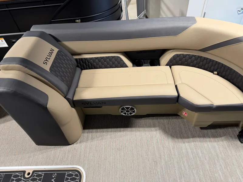 Slide: The Image of The image shows a beige and black seating area in a Sylvan boat. - 8