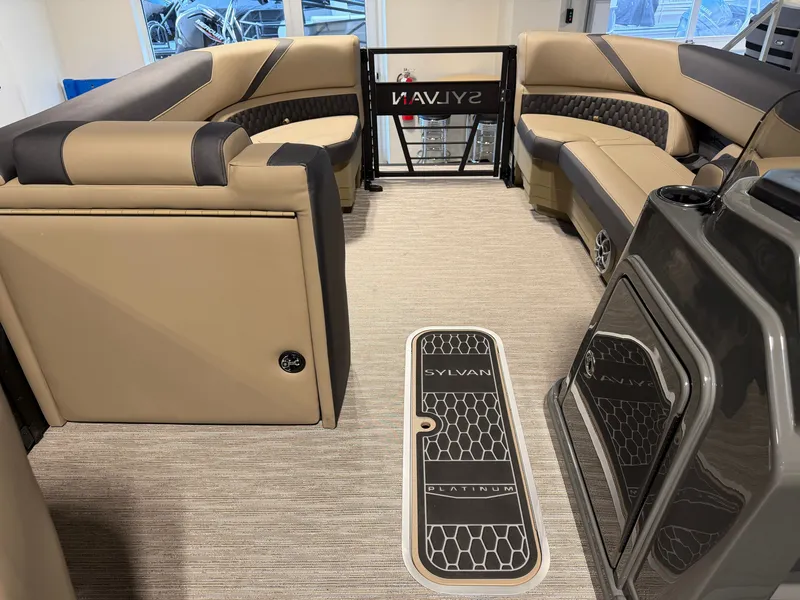 Slide: The Image of The image shows the interior of a 2027 Sylvan X5 DLZ DH BAR boat with sleek seating. - 10