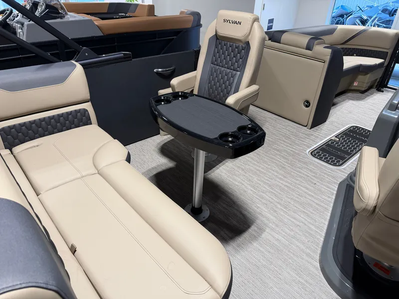 Slide: The Image of Interior of a 2027 Sylvan X5 DLZ DH BAR with sleek seating and a table. - 17
