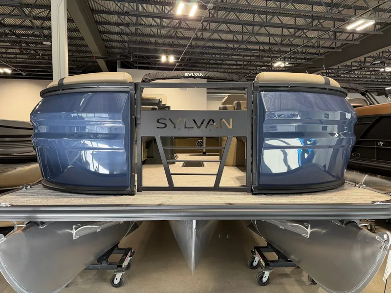Slide: The Image of A 2027 Sylvan X5 DLZ DH BAR pontoon boat in a showroom. - 1