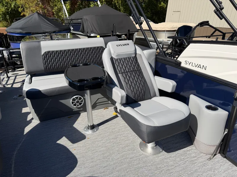 Slide: The Image of 2027 Sylvan X5 DLZ DH BAR with luxurious gray seating and a small table. - 11