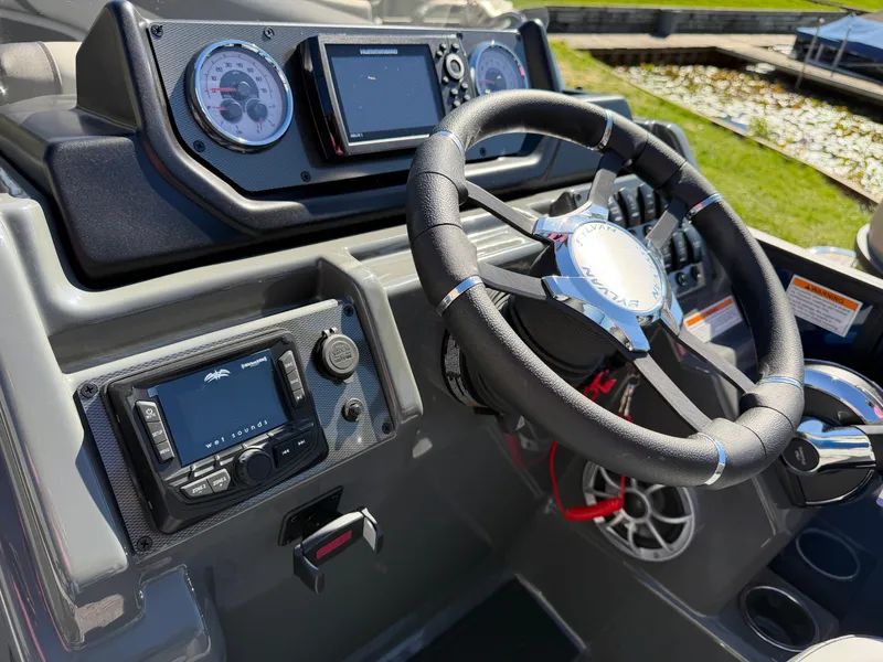 Slide: The Image of The image shows the helm of a Sylvan X5 DLZ DH BAR boat with modern instruments. - 18