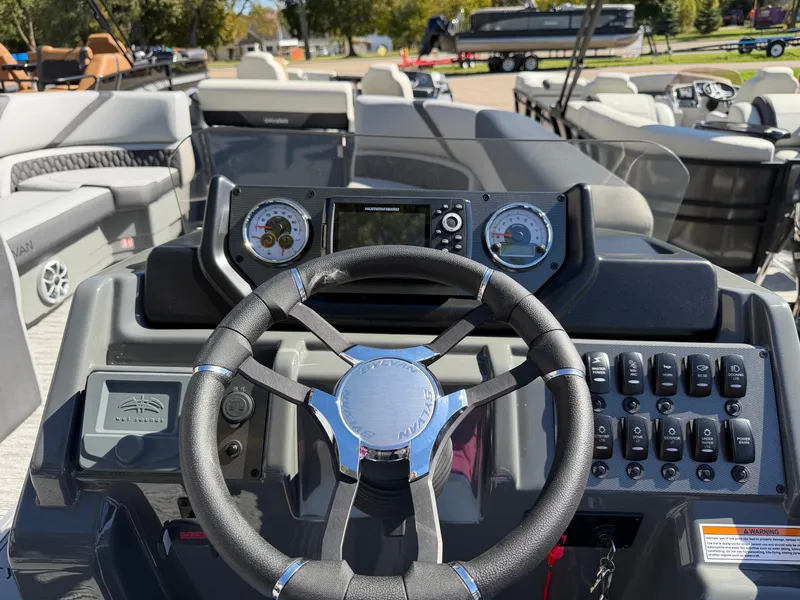 Slide: The Image of Helm of a 2027 Sylvan X5 DLZ DH BAR with modern instruments and controls. - 17