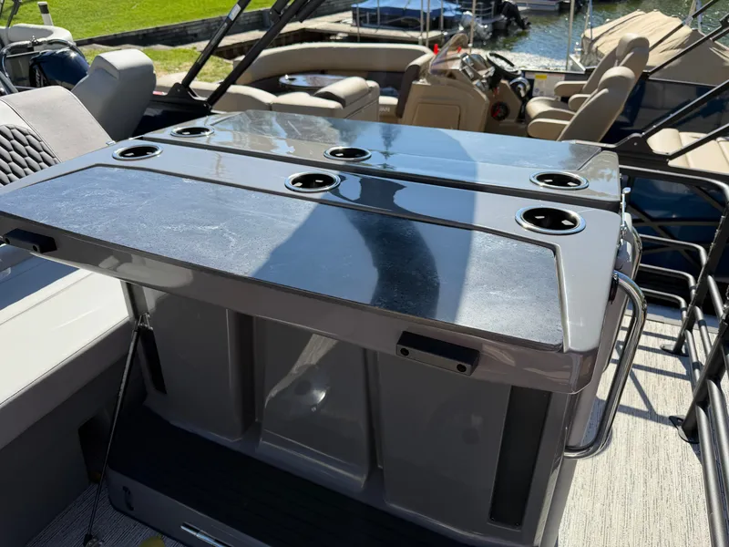 Slide: The Image of A modern boat table with cup holders on a 2027 Sylvan X5 DLZ DH BAR. - 24