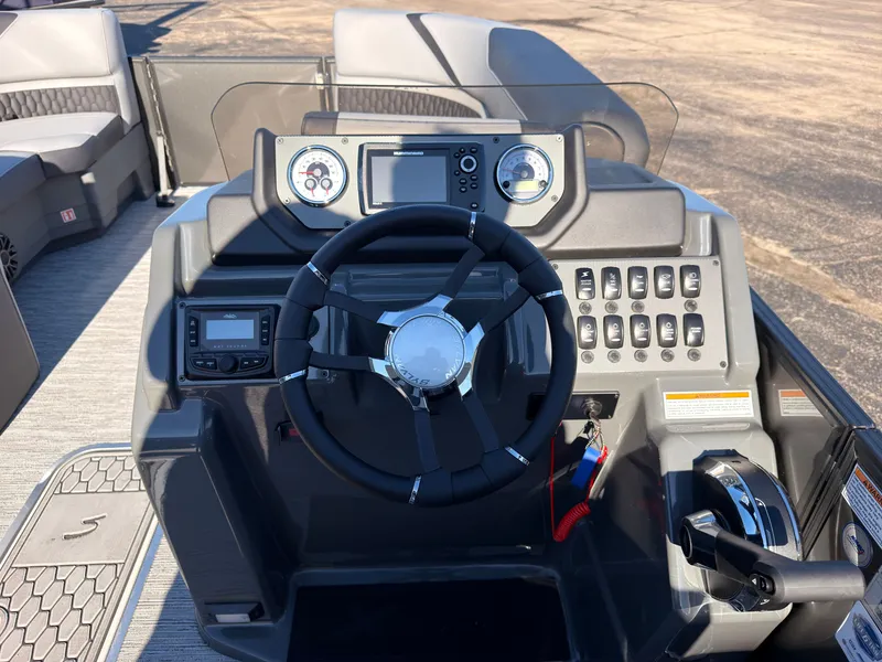 Slide: The Image of The image shows the helm of a Sylvan X3 LZ DH boat with modern instruments. - 40