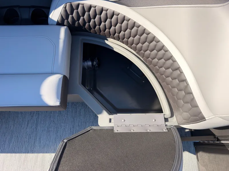 Slide: The Image of Close-up of a seating area with gray upholstery and honeycomb pattern on a Sylvan X3 LZ DH boat. - 14
