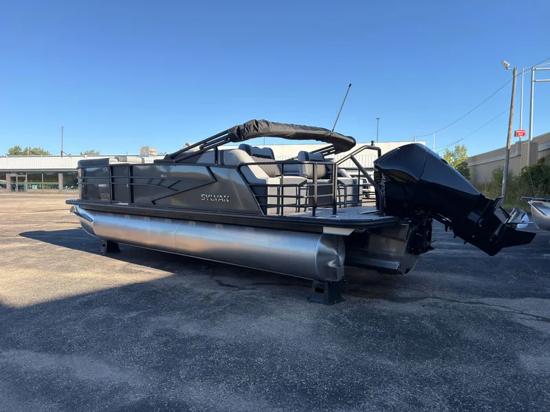 Slide: The Image of The image shows a 2027 Sylvan X3 LZ DH pontoon boat on a parking lot. - 5