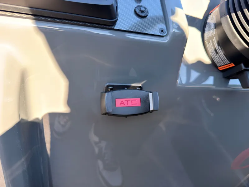 Slide: The Image of Close-up of a switch labeled "ATC" on a gray boat panel. - 45
