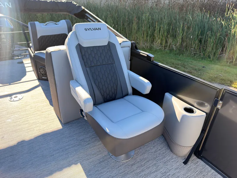 Slide: The Image of The 2027 Sylvan X3 LZ DH features a luxurious captain's chair with padded armrests and a cup holder. - 33