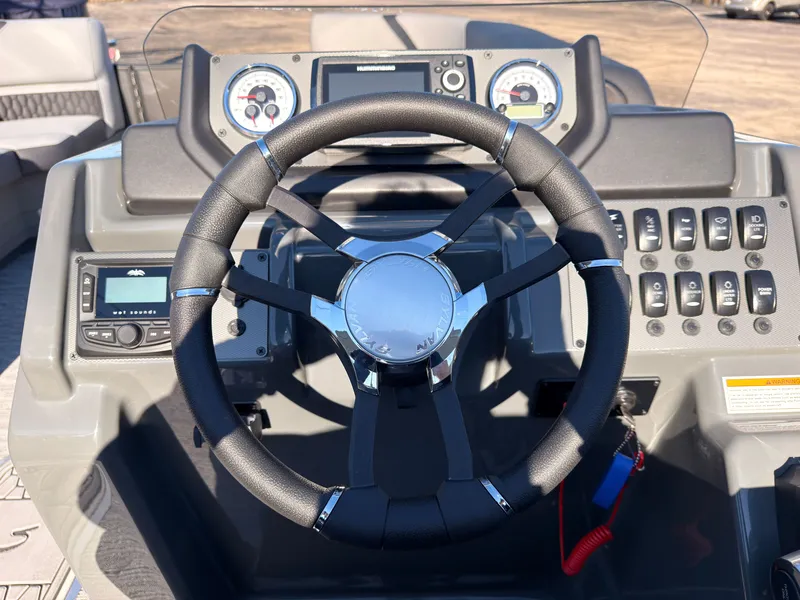 Slide: The Image of The image shows the helm of a Sylvan X3 LZ DH boat with modern instruments. - 46