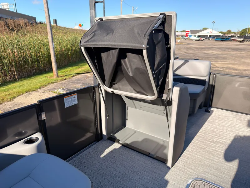 Slide: The Image of The image shows the interior of a 2027 Sylvan X3 LZ DH with a foldable seat. - 36