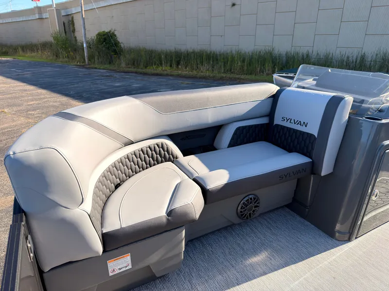 Slide: The Image of The image shows a modern, gray boat seat with Sylvan logo, installed on a boat. - 10