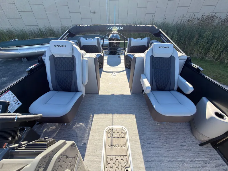 Slide: The Image of The image shows the interior of a 2027 Sylvan X3 LZ DH boat with luxurious seating. - 32