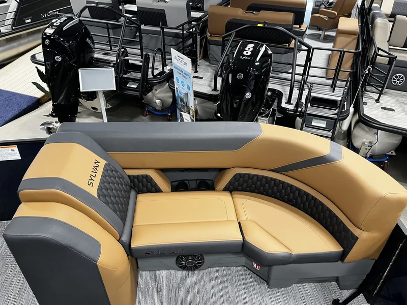 Slide: The Image of The image shows the luxurious seating area of a Sylvan X3 LZ DH pontoon boat with stylish design. - 7