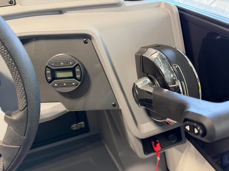 Slide: The Image of Close-up of the helm of a 2027 Sylvan R-20 CLZ DH with throttle and controls. - 14