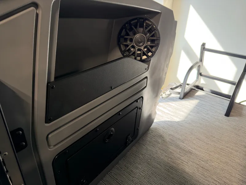 Slide: The Image of Close-up of a speaker and storage area on a boat. - 20