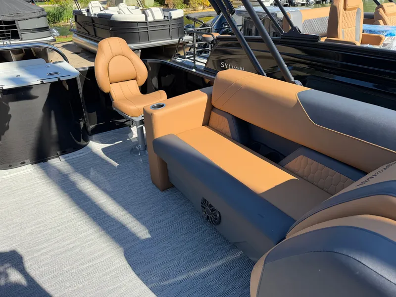 Slide: The Image of The image shows the interior of a 2027 Sylvan Q-20 Party Fish with comfortable seating. - 19